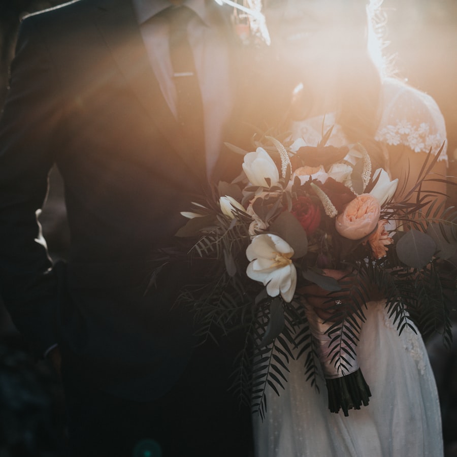 Bride and groom with a lush bridal bouquet